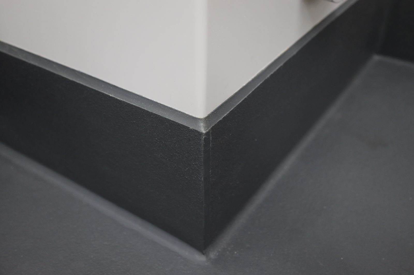 Eco-Grip integral cove base turning up the wall at an inside corner, welded seamless